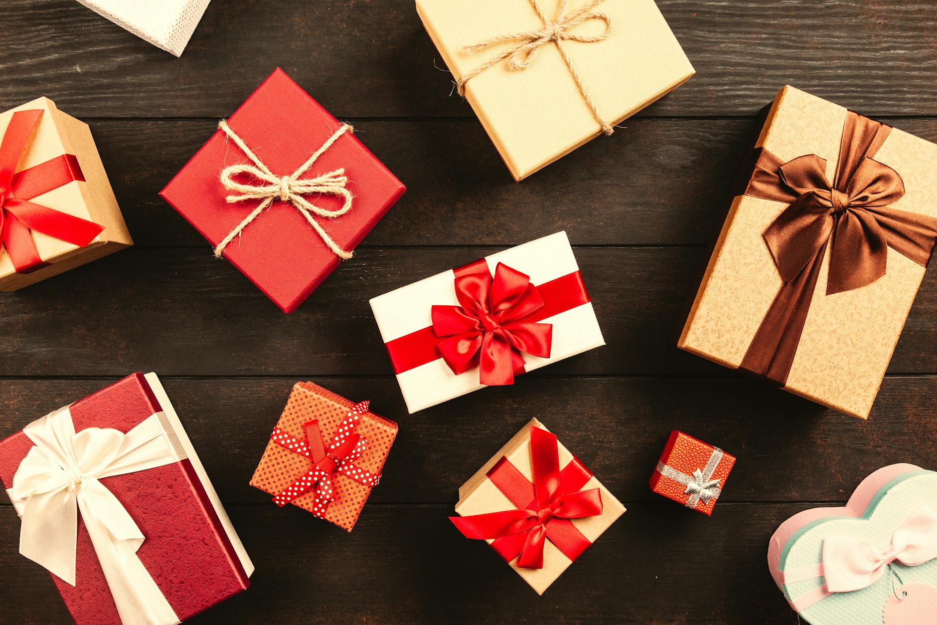 wrapped gift boxes with ribbons on table