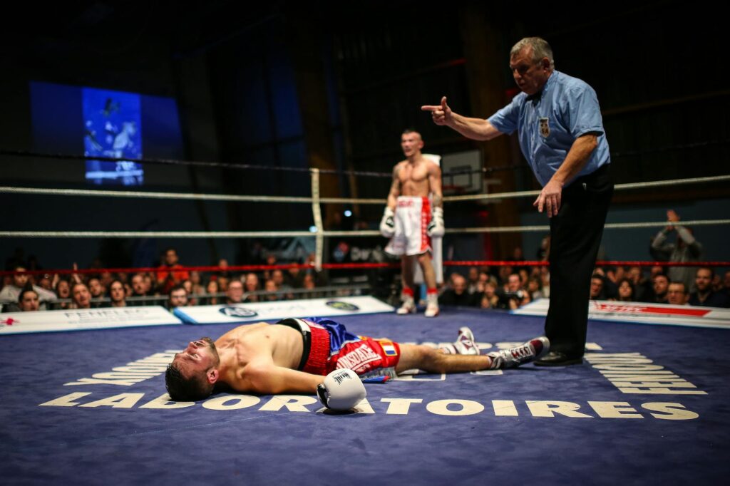 boxer knocked out in a boxing ring