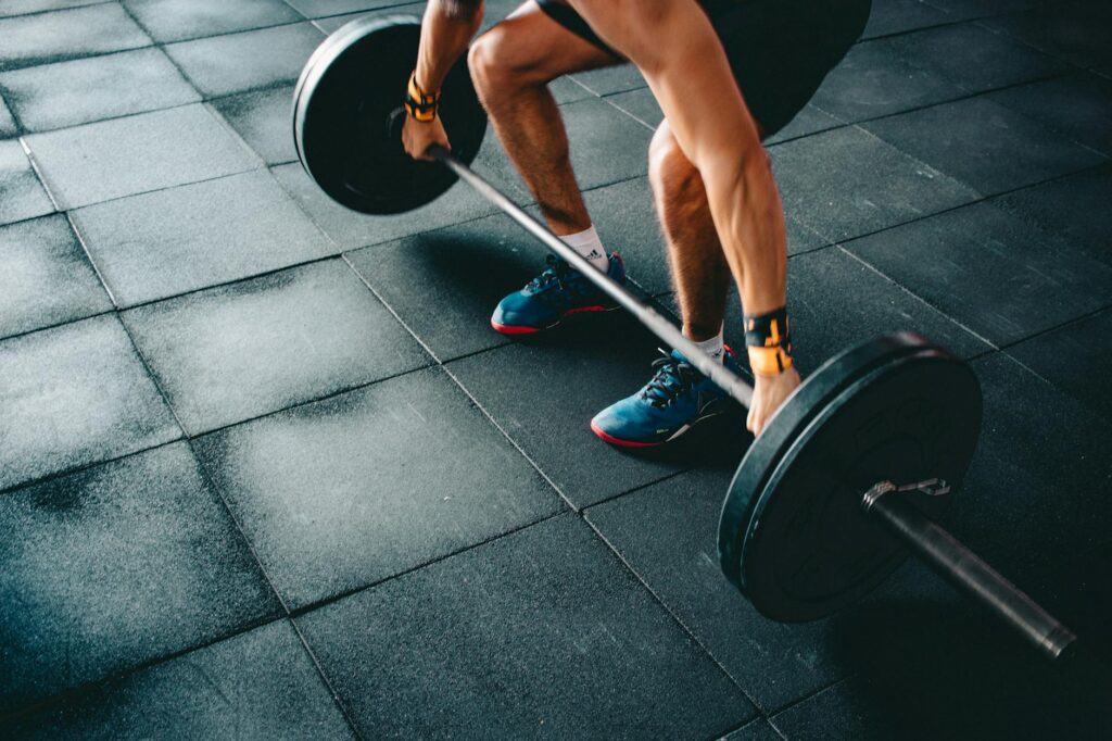 person holding barbell